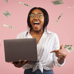 Happy investor with laptop.jpg