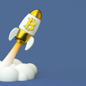 Toy spaceship with bitcoin logo launching.jpg
