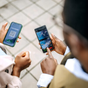 Young colleagues checking their crypto investment app.jpg