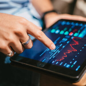 Man checking stock market data tablet 1024x683.jpg