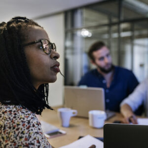 Investors watch a presentation around a table.jpg