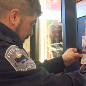 12 30 2025 gi police officer cryptocurrency warning on machine 1200x675.jpg