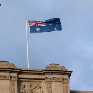 Australian national flag waving on the parliament house in melbourne victoria australia.jpg